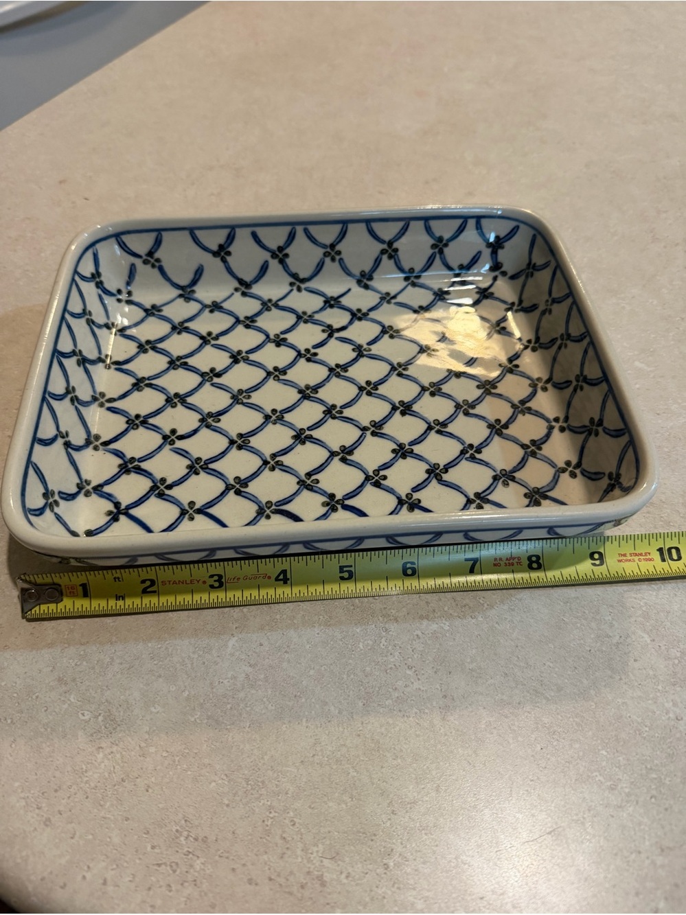 Polish pottery dish features a blue trellis pattern